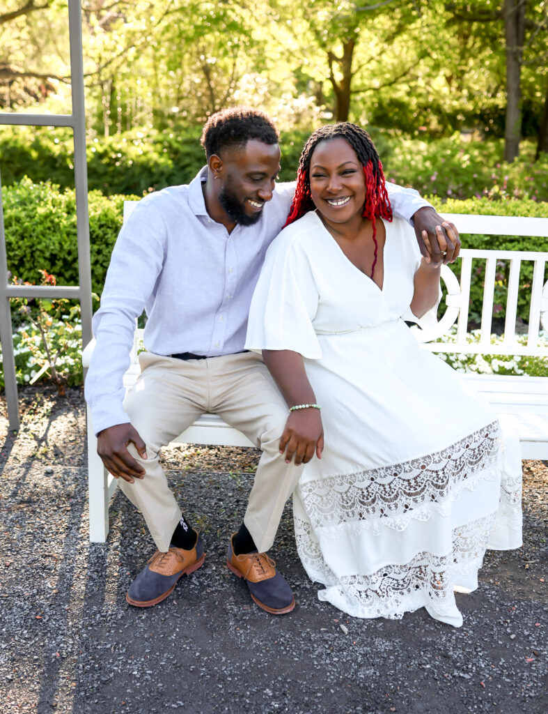 black engaged couple holding hands laughing in Columbus Georgia by Amanda Richardson Photography