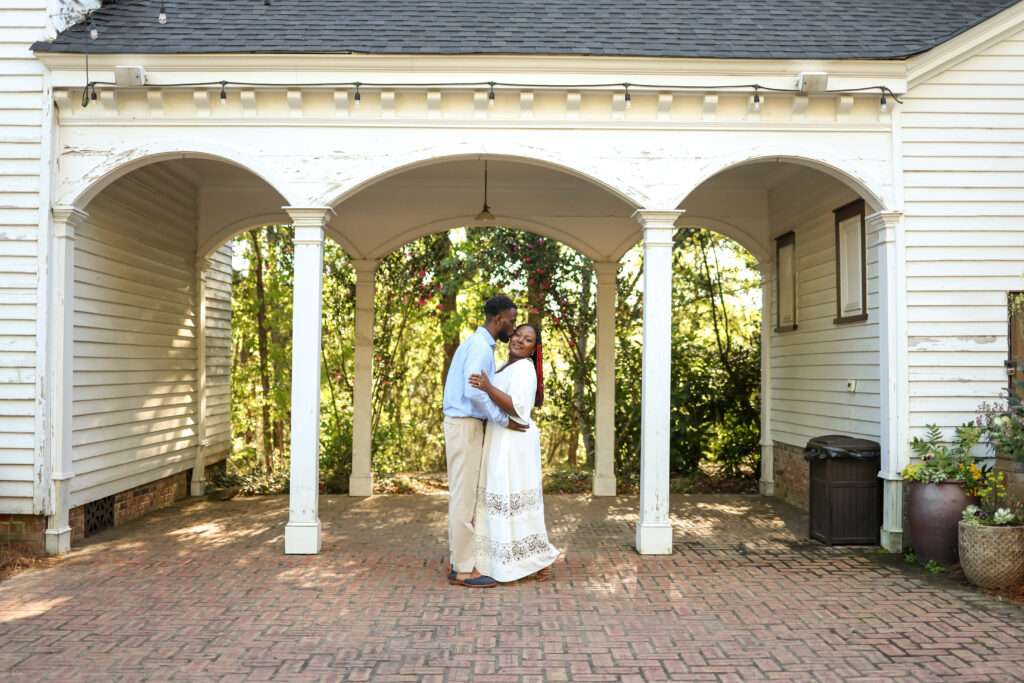 Black couple hugging at Columbus Botanical Garden by Amanda Richardson Photography