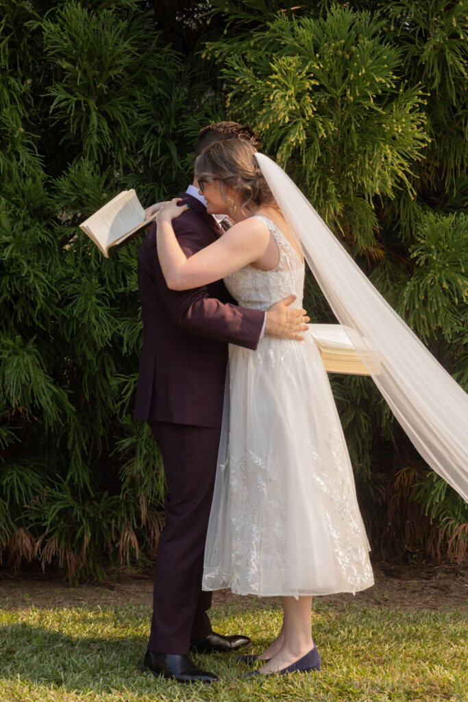 couple holding each other during wedding at The Whiskey Bonding Farm in Molena Georgia