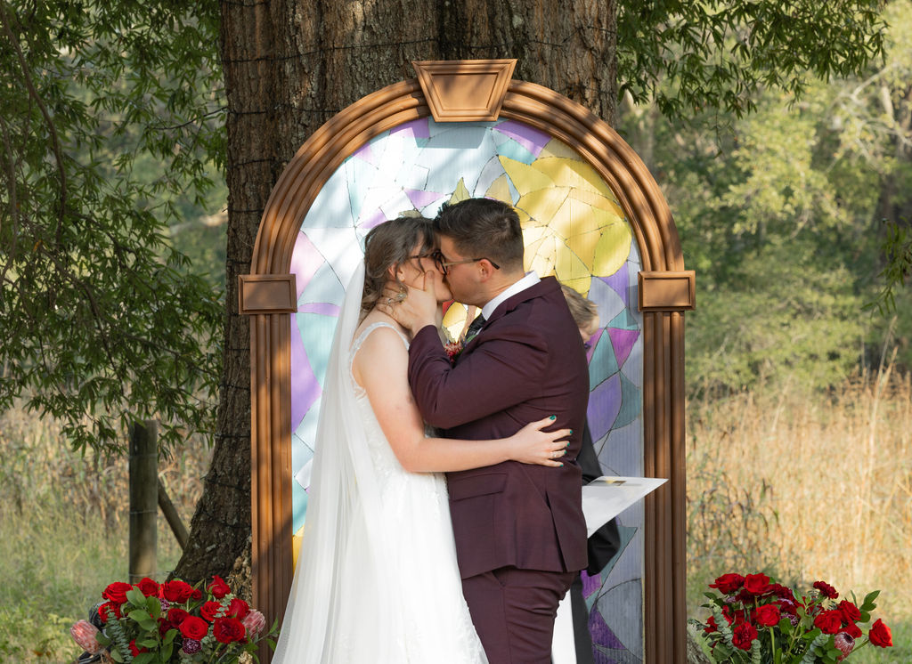 bride and groom first kiss at The whiskey bonding farm photographed by Amanda Richardson Photography