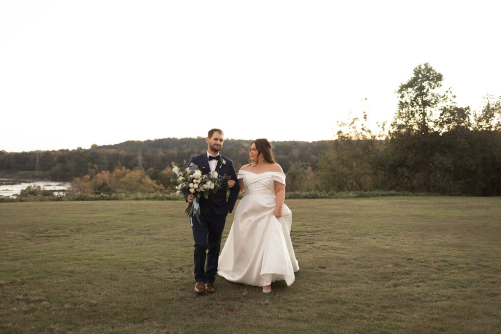 Bride and Groom holding hands at sunset in Columbus Georgia